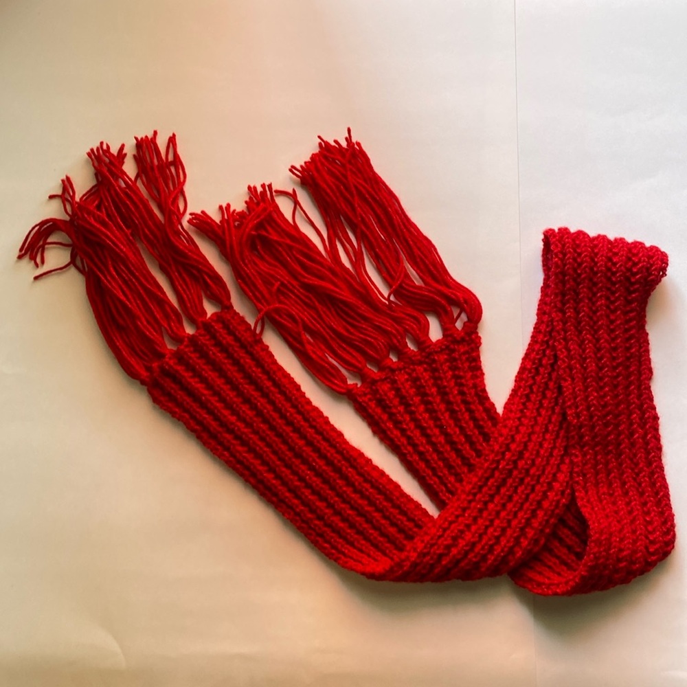 Hand knitted red winter scarf. Never worn. You can trim the tassels if you want